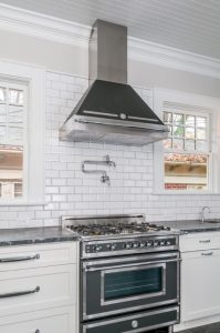 Craftsman style kitchen with stove and range