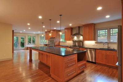 Craftsman kitchen in a whole house renovation with wood toned cabinets