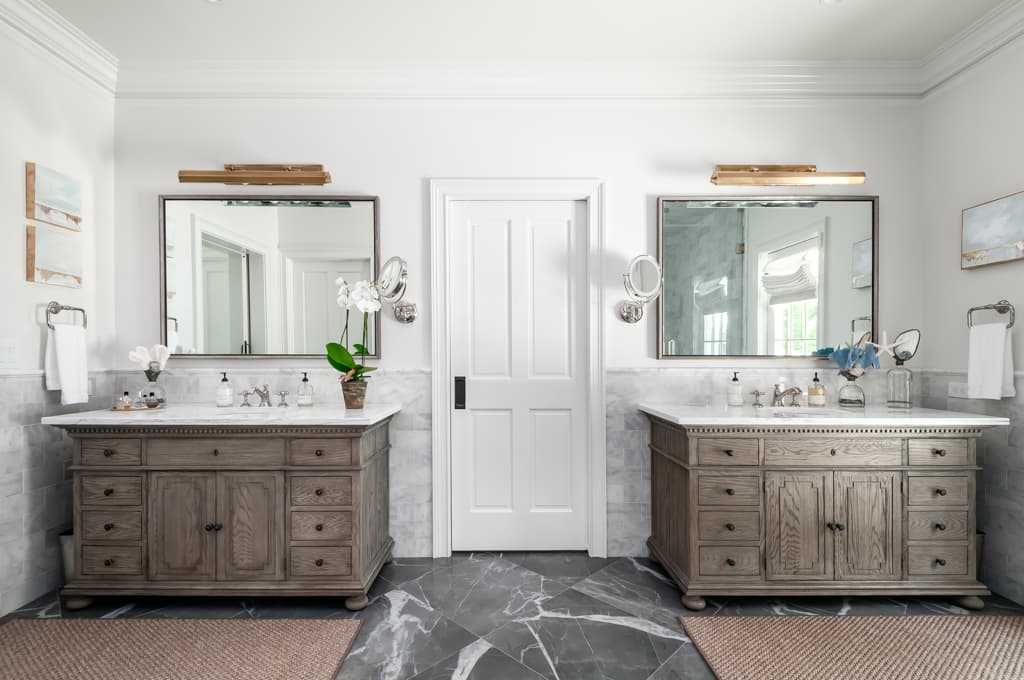 Elegant marble bathroom with mixed metal finishes and 2 vaniety sinks