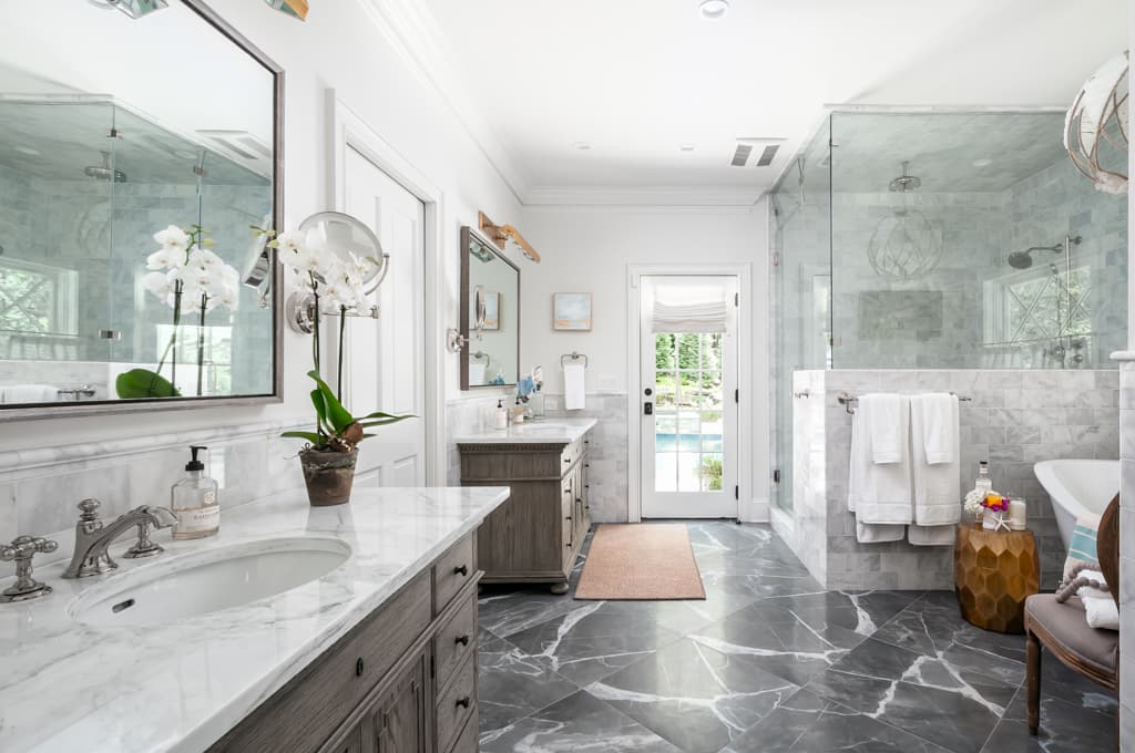 Elegant marble bathroom with freestanding shower and 2 vaniety sinks
