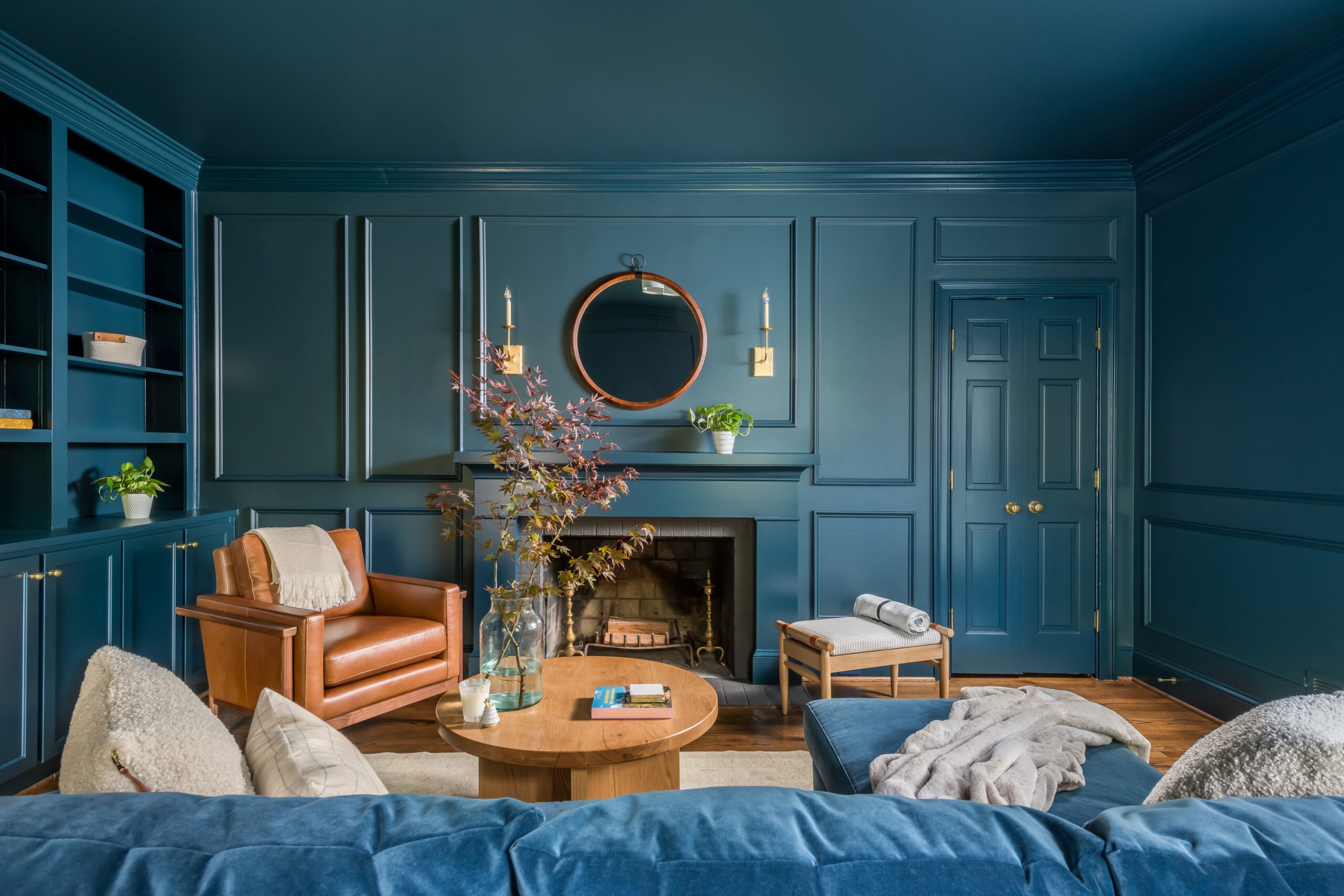 Aesthetic family library with blue walls and couch