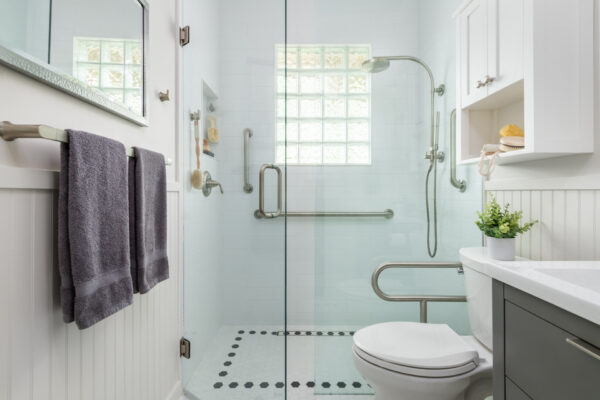 Stylish age-in-place bathroom remodel with grab bars and curbless shower