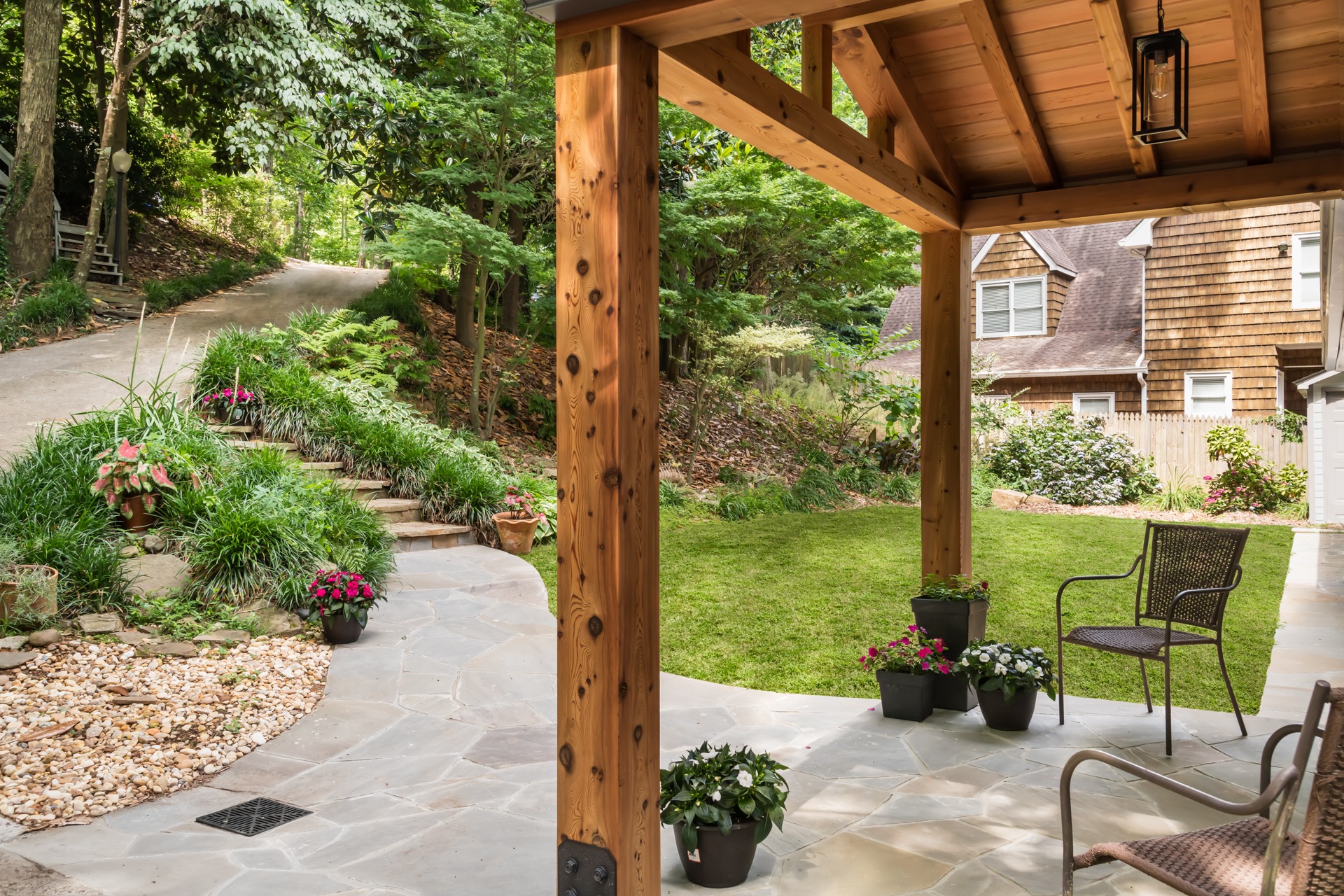 Cedar portico with winding path through landscaping