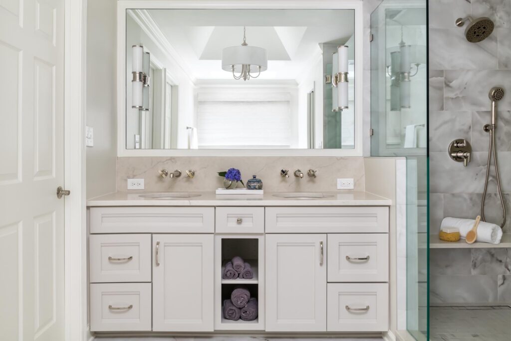 bathroom makeover with walk-in shower and white vanity