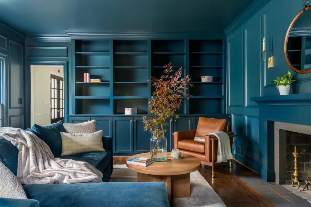 A modern blue living room with amenties