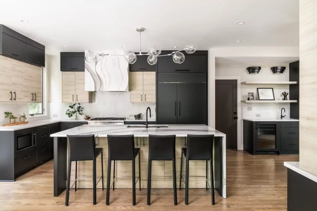 large modern kitchen with waterfall marble counter