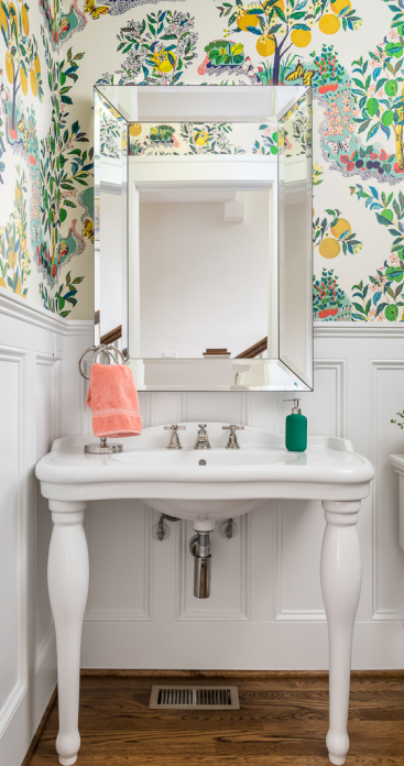 single sink vanity with mirror and floral wallpaper