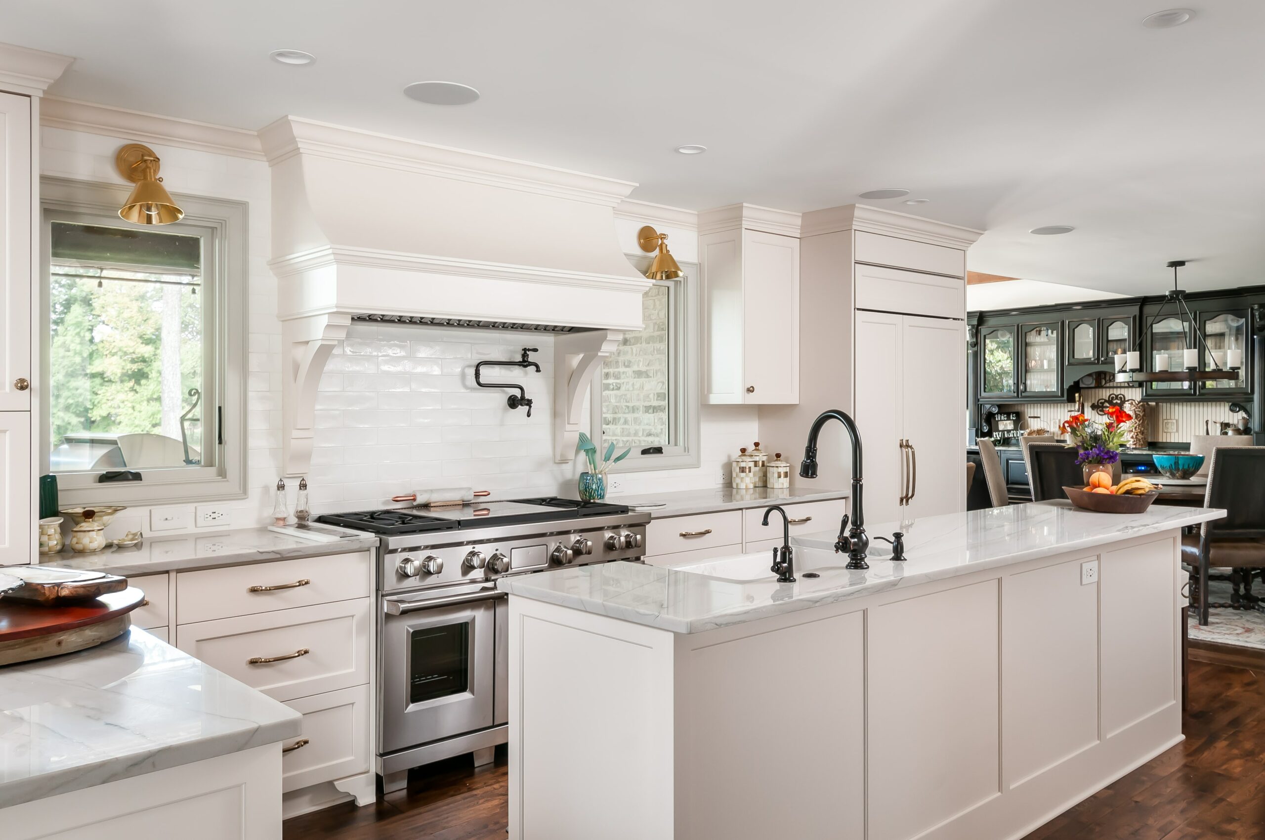 Bright white kitchen design with stainless steel appliances