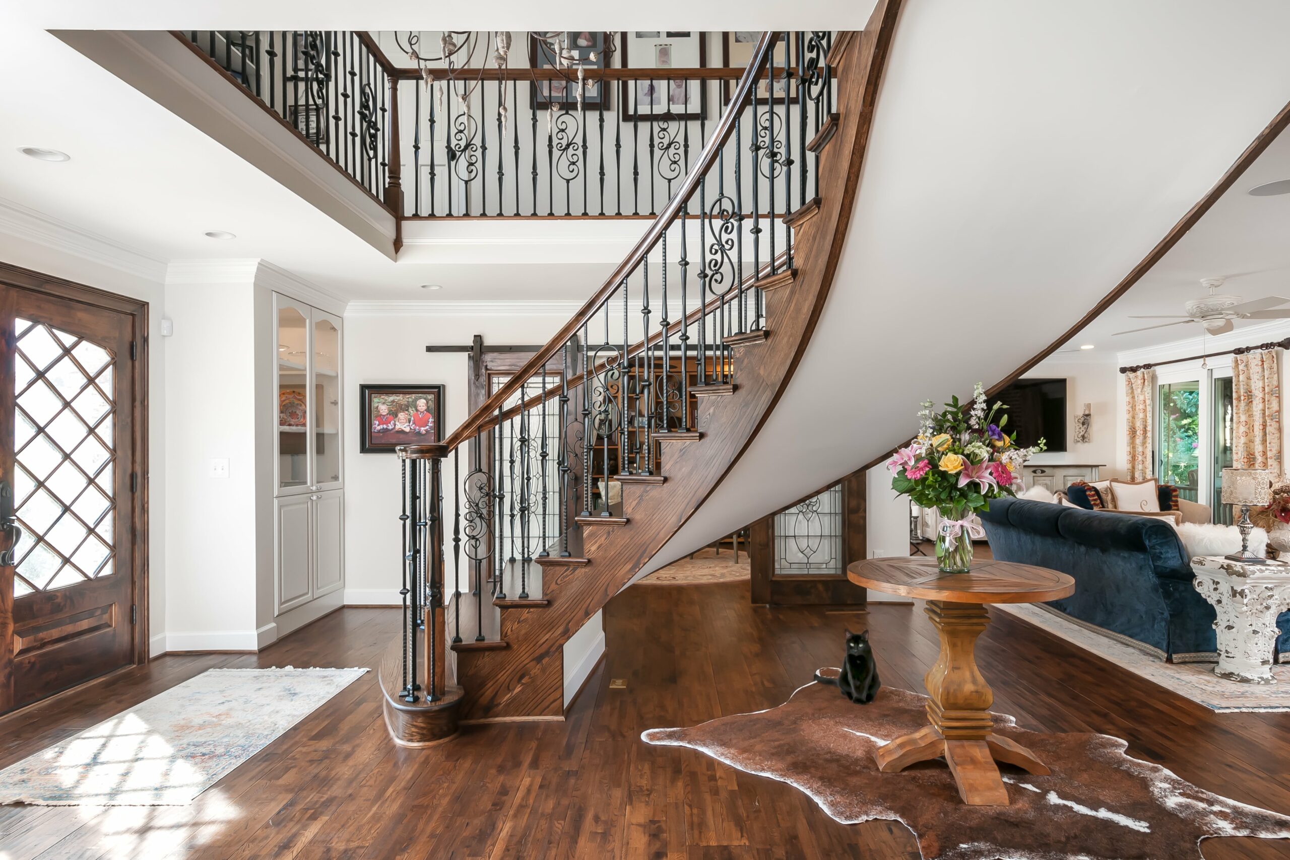 Entry way with french style wooden spiral staircase