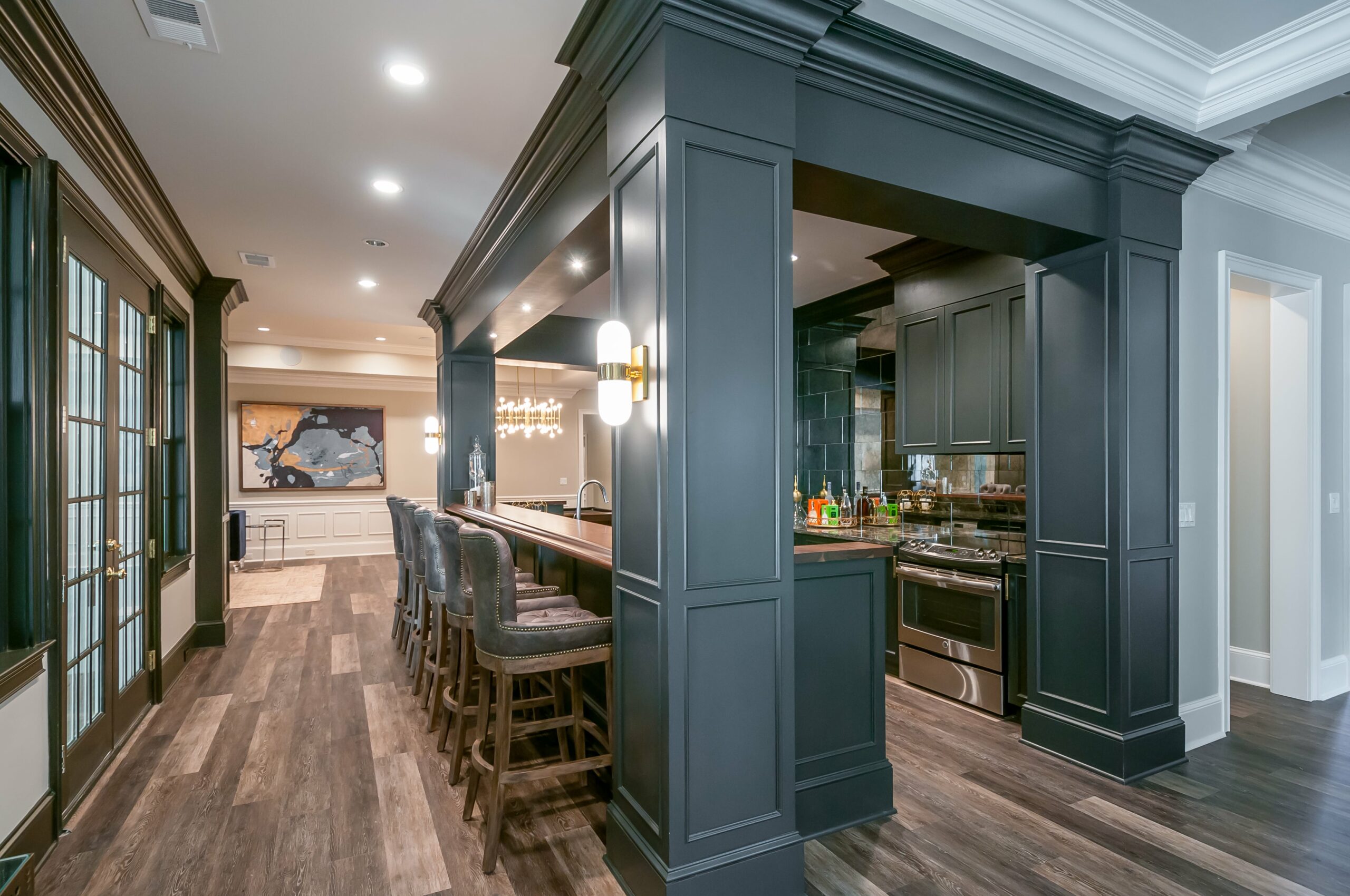 Dark basement kitchen and bar design in Alpharetta home remodel
