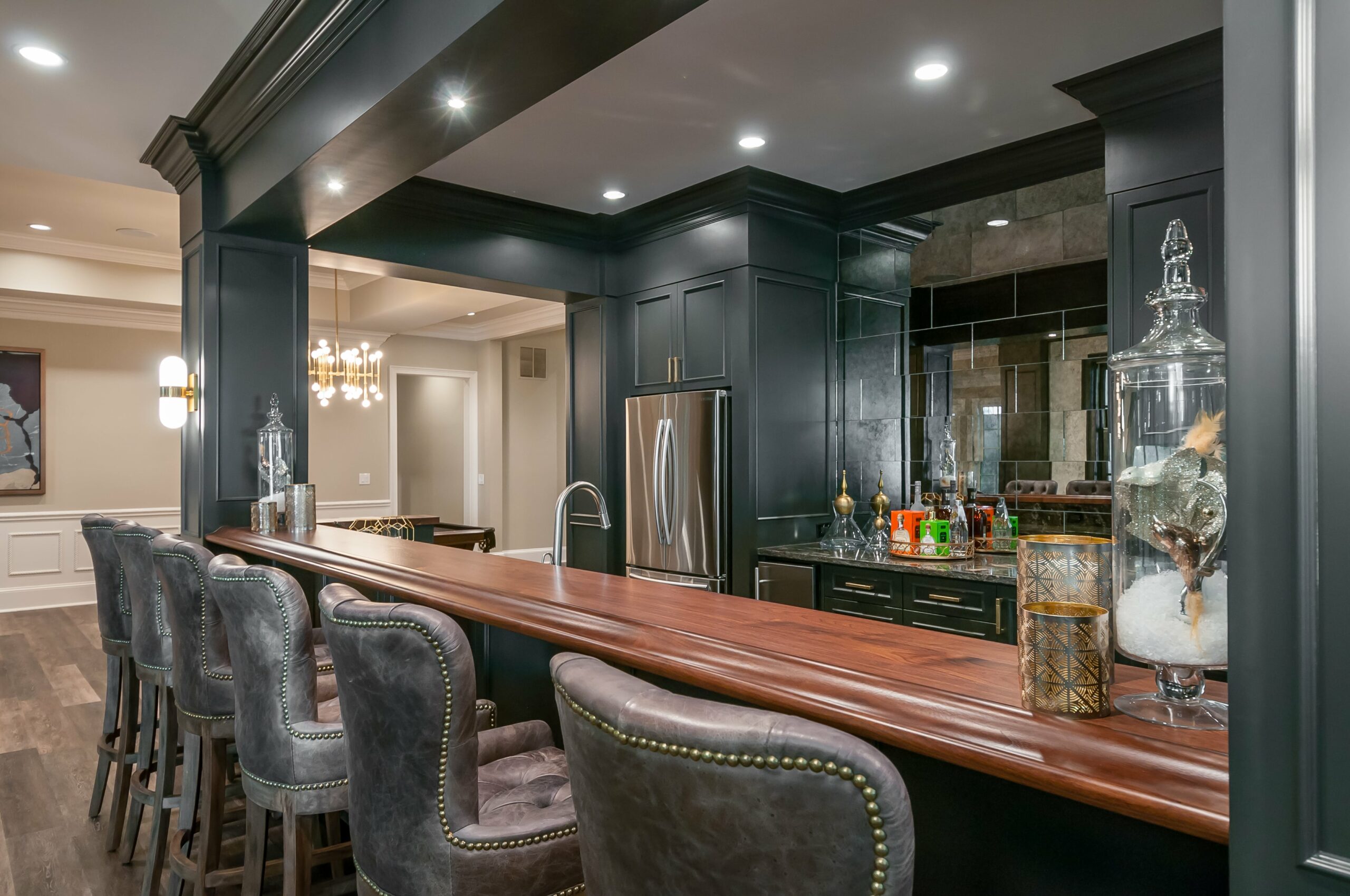 Dark basement kitchen and bar design in Alpharetta home remodel