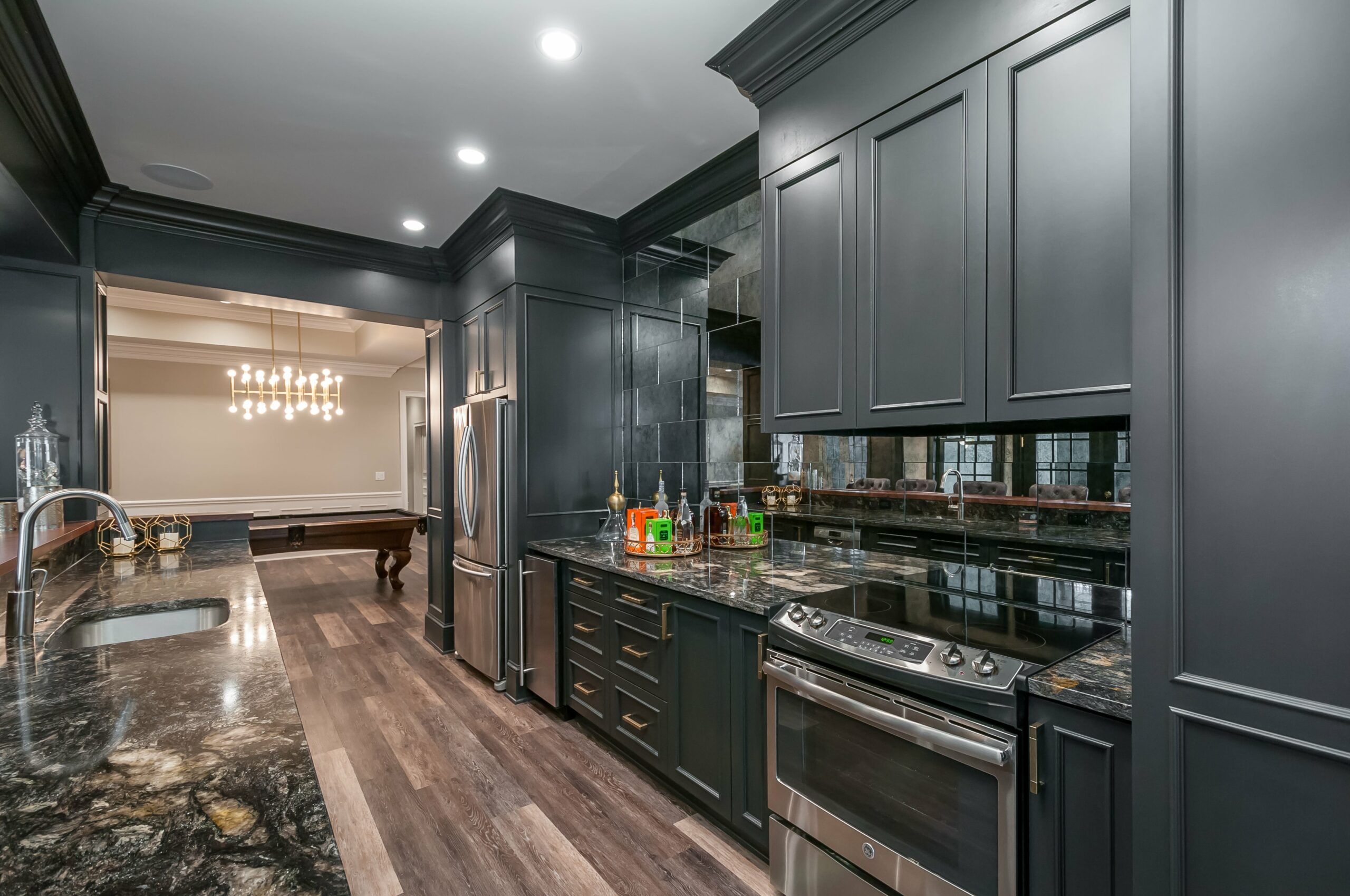 Basement kitchen remodel with dark cabinets and countertops