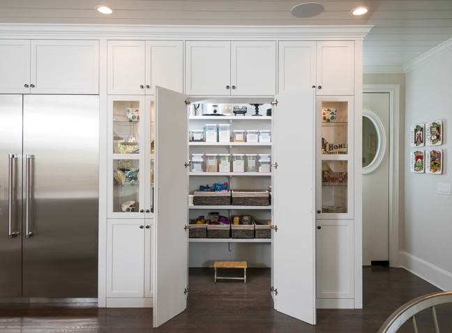 open doors to a large kitchen pantry