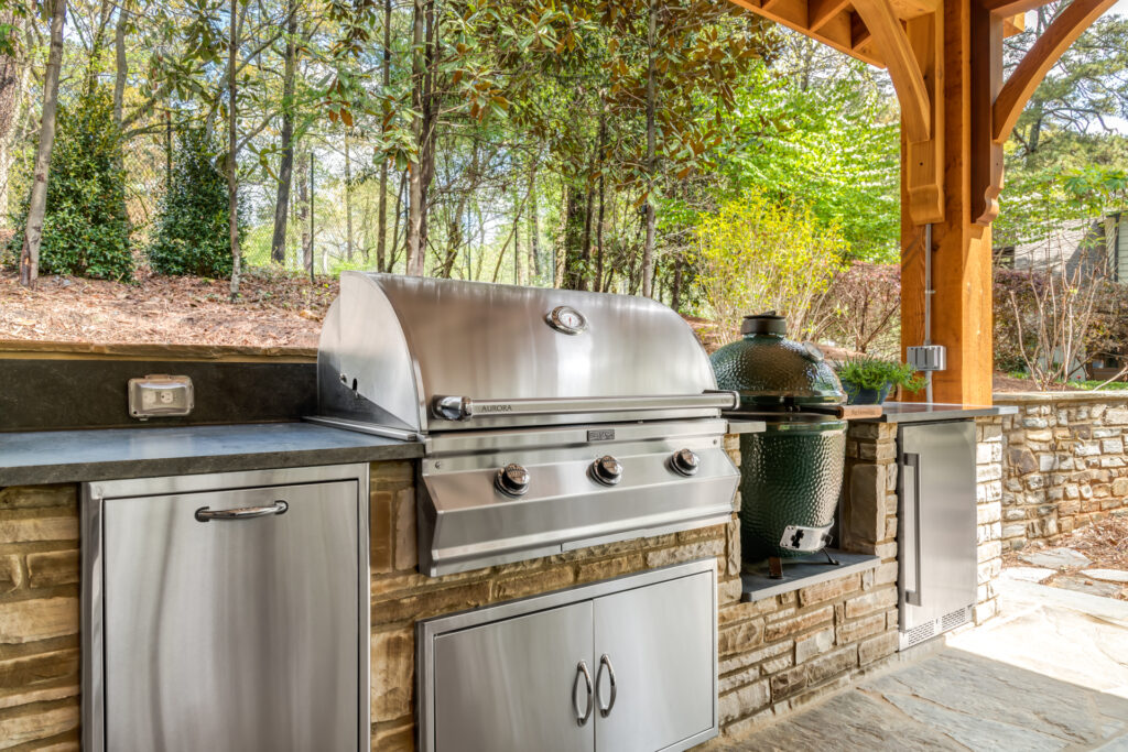 an outdoor kitchen with stainless steel appliances How to plan a fabulous outdoor kitchen big green egg
