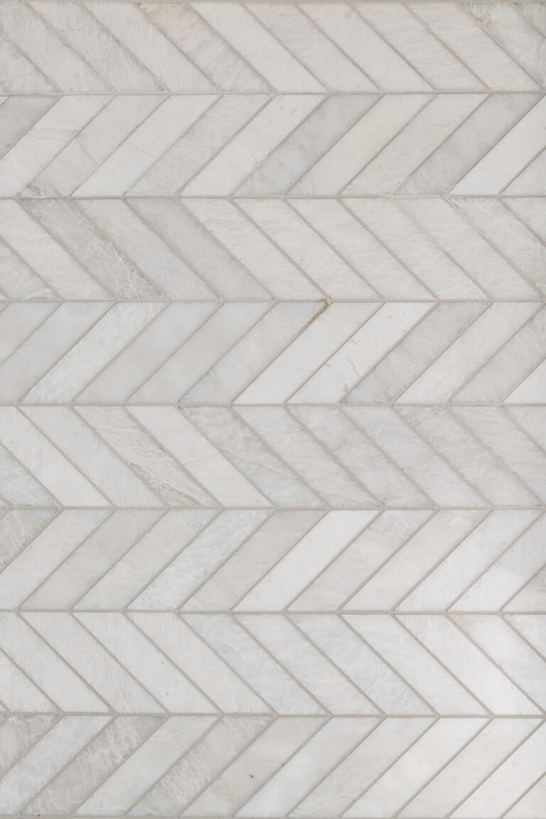 a white marble herringbone tile pattern