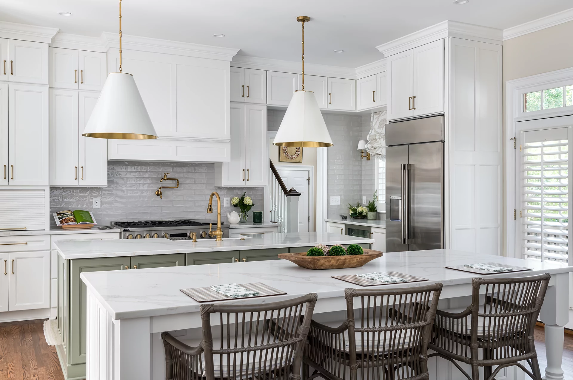 A newly remodeled kitchen with white and gold design
