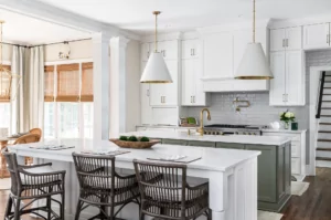 A newly remodeled kitchen with white and gold design