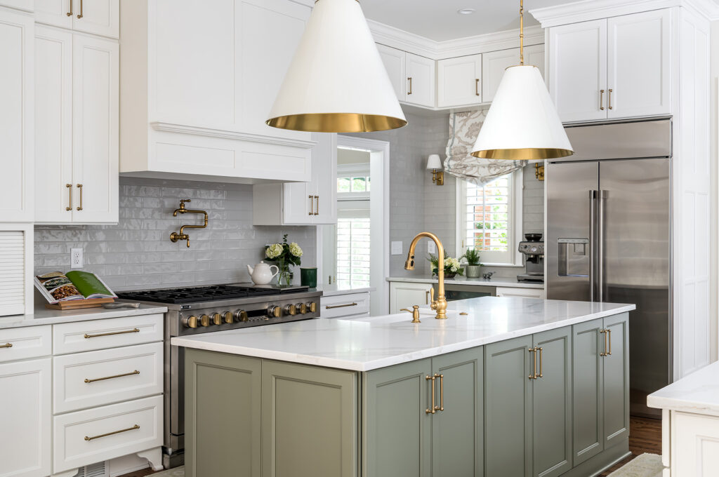 newly remodeled kitchen with modern light fixtures & green cabinets