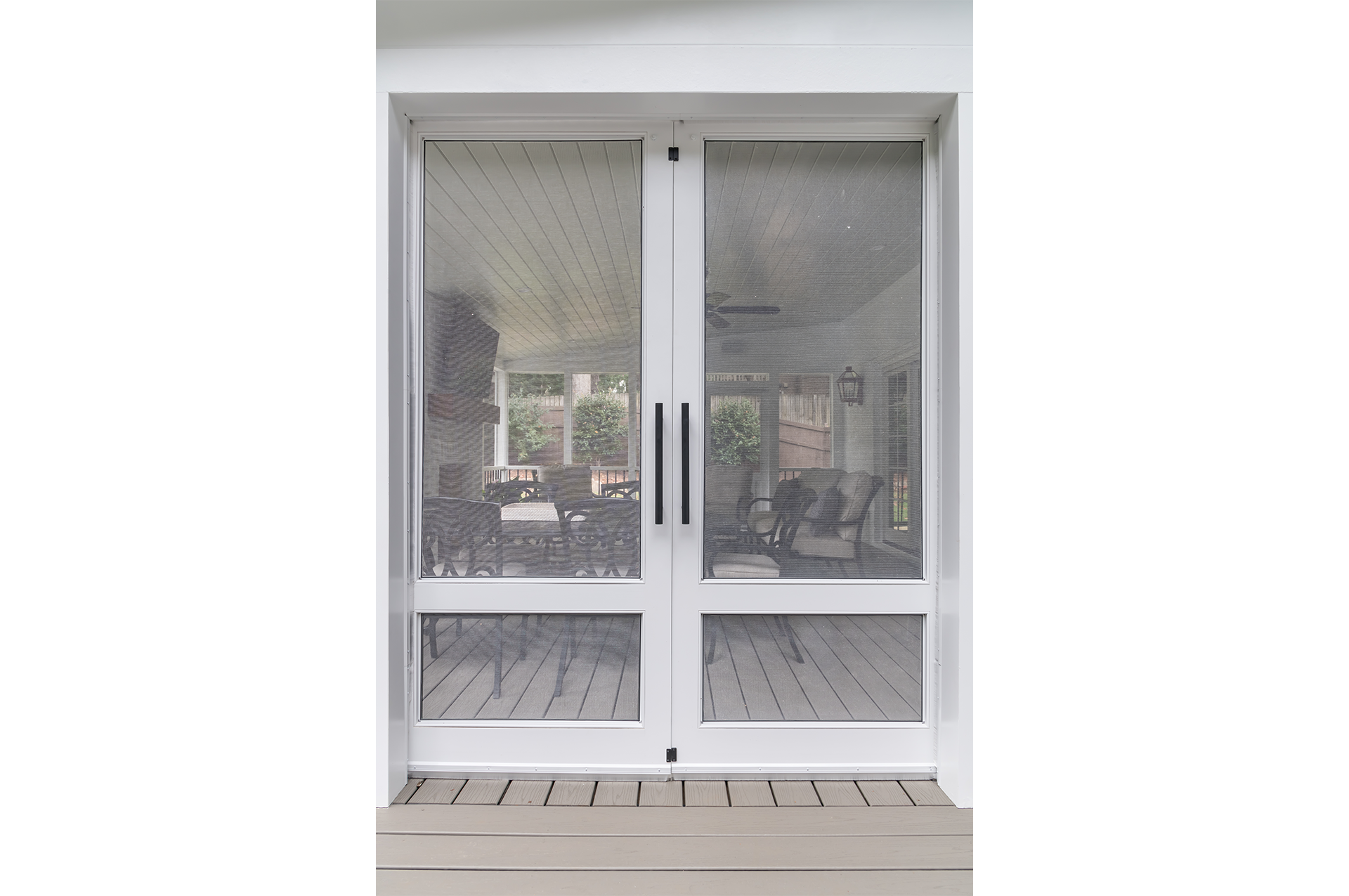 Closed screen doors on a newly remodeled screen porch