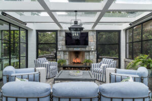 sunroom with fireplace and sitting area