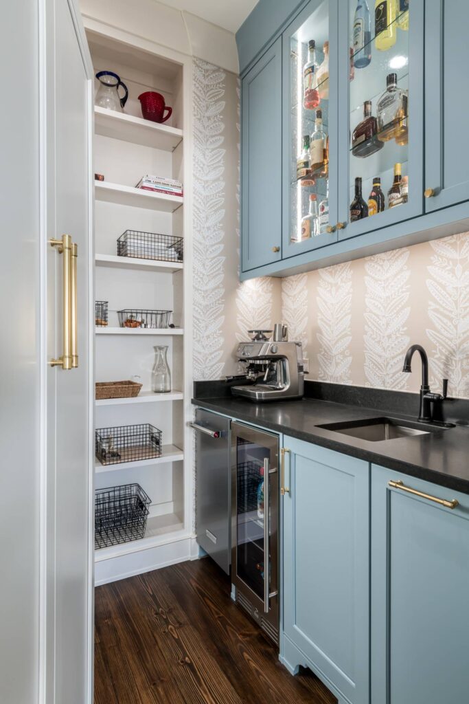 new blue kitchen with built in pantry