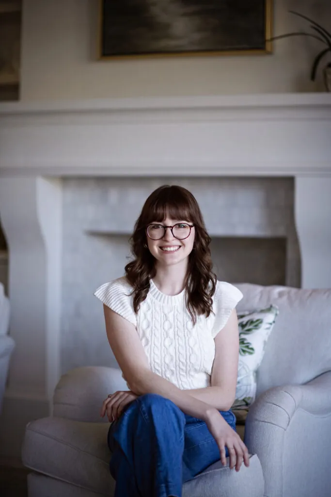 a woman sitting on a couch in a living room
