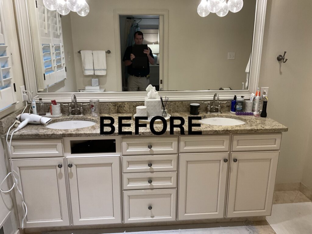 a bathroom with two sinks and a large mirror