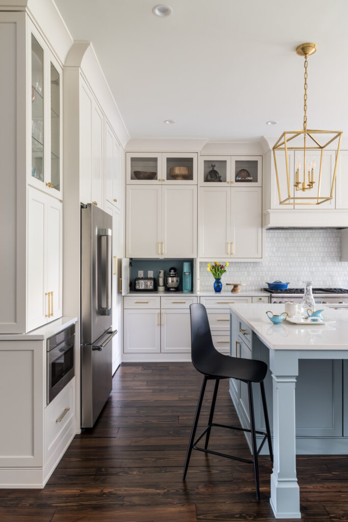 a kitchen with white cabinets and a large island perfect your chef's kitchen