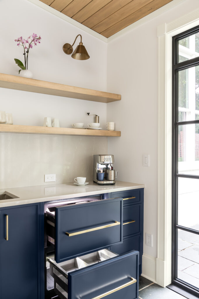 a home bar with refrigerator drawers