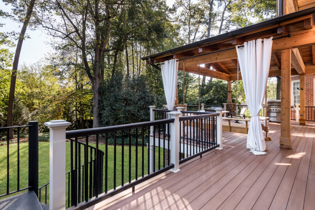 refined rustic porch and deck remodel in Sandy Springs, Georgia with porch swing daybed
