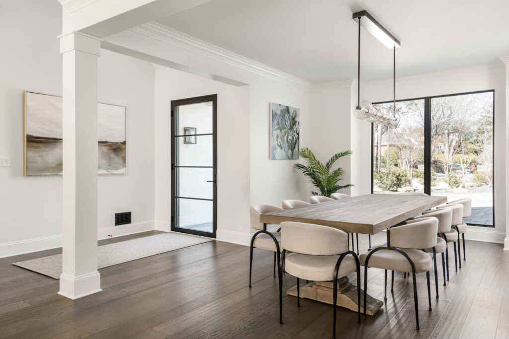 a dining room with a table and chairs