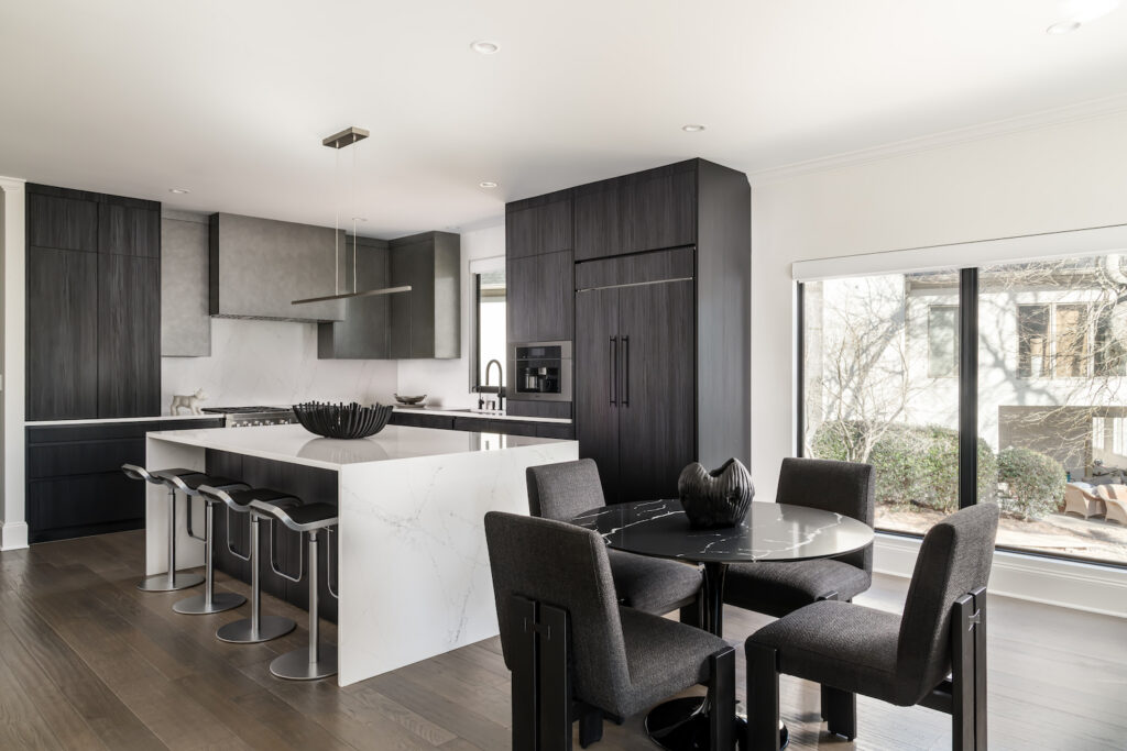 Minimalist Modern Kitchen a kitchen with a table, chairs, and an island