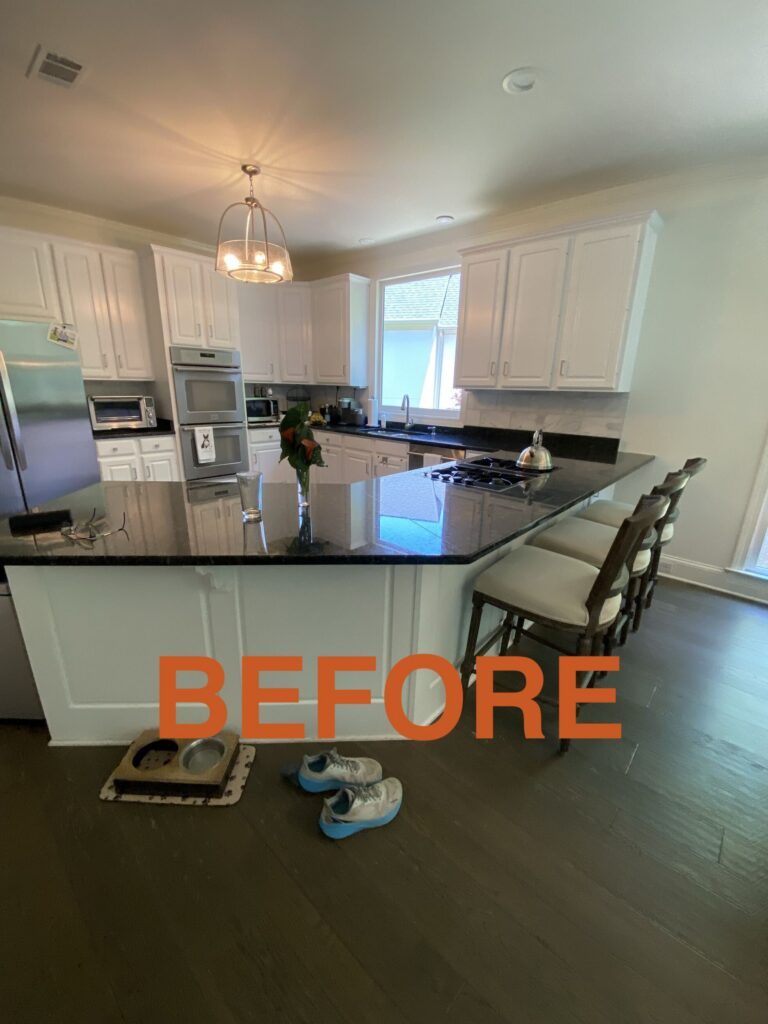 a kitchen with a large island and a stove top oven