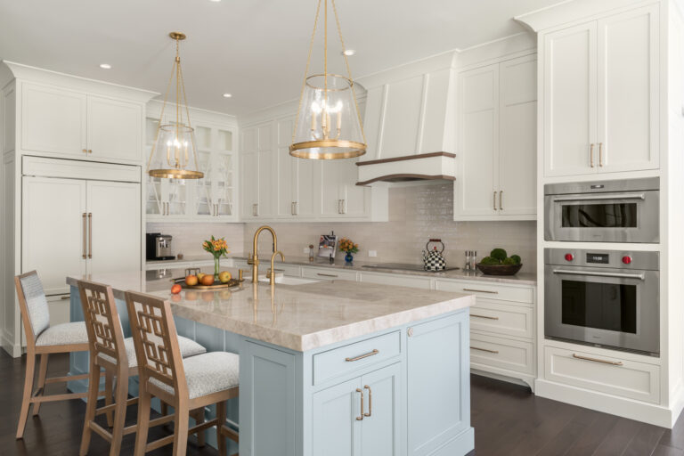 a large kitchen with a center island and a breakfast bar