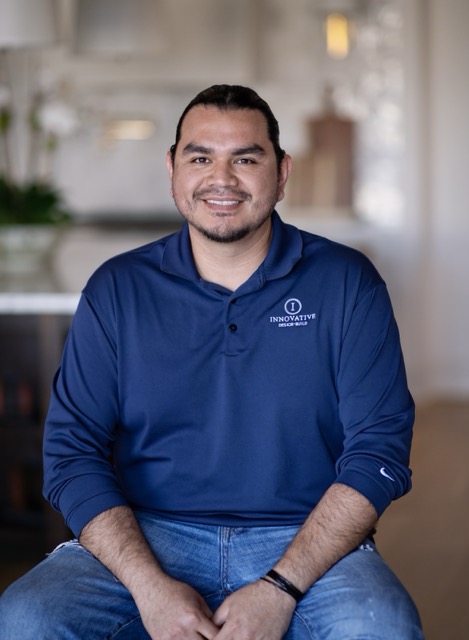 a man sitting on a couch in a living room