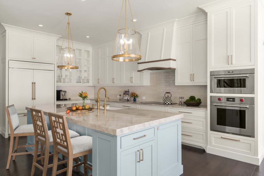 calming and cohesive color on the kitchen island and taj mahal quartz on the countertops