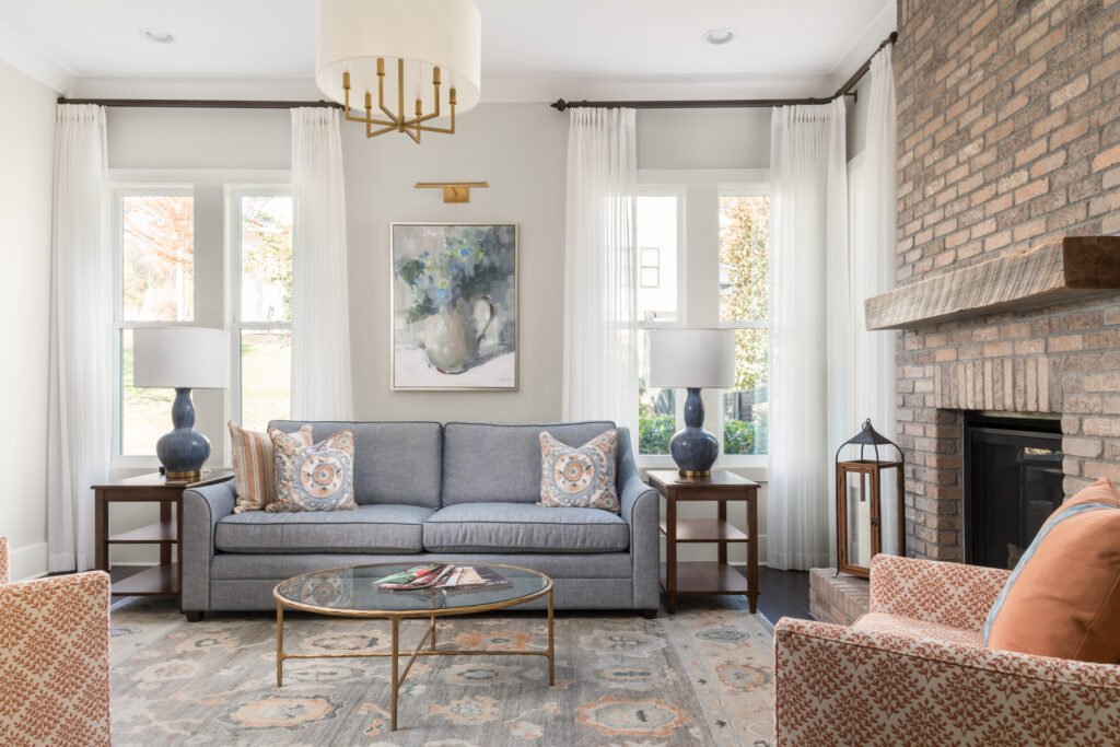 calming and cohesive living room with an opposite colors color story and a fireplace