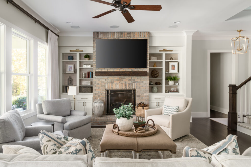 a living room filled with furniture and a flat screen tv