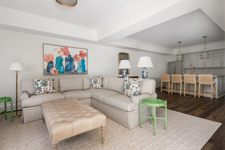 a living room filled with furniture and a large window