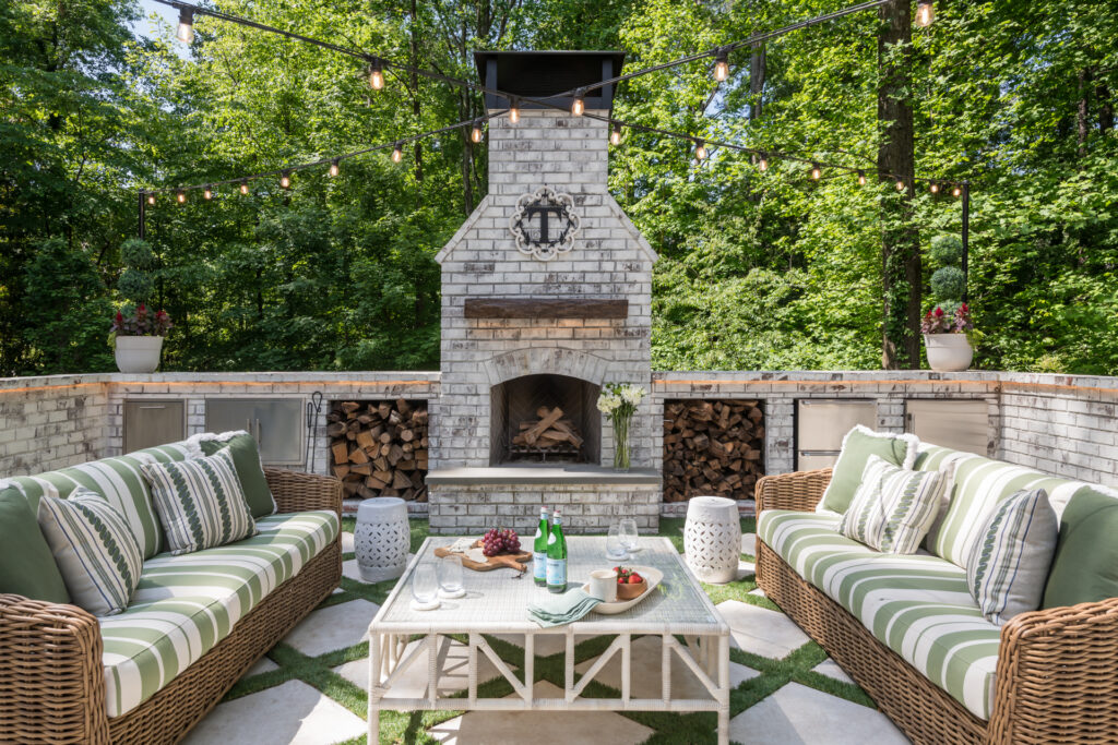 outdoor living space terrace with outdoor fireplace and outdoor fridge drawers