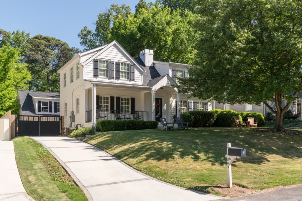 Enhanced curb appeal and new garage, new driveway and new front walk