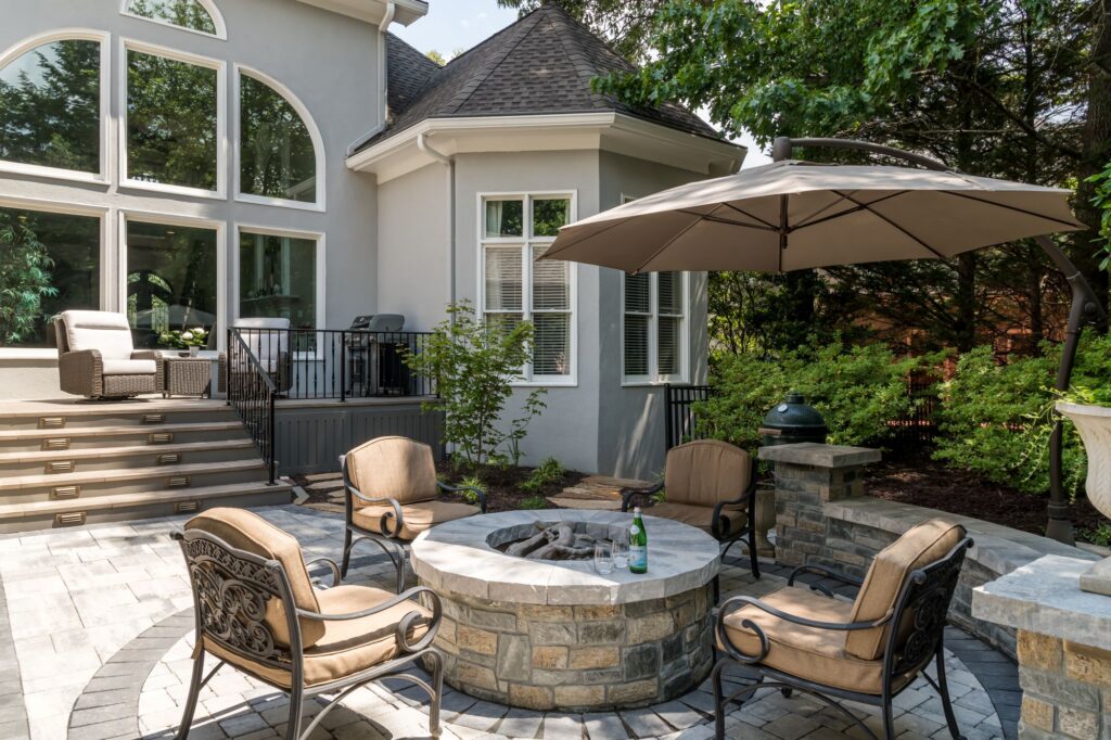 Fire pit patio and a rebuilt deck in a series of outdoor rooms in John's Creek, Georgia